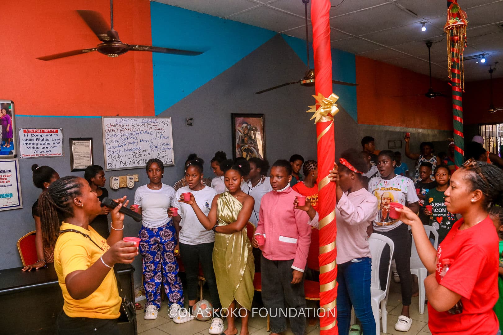 A volunteer speaking with children during a Christmas outreach