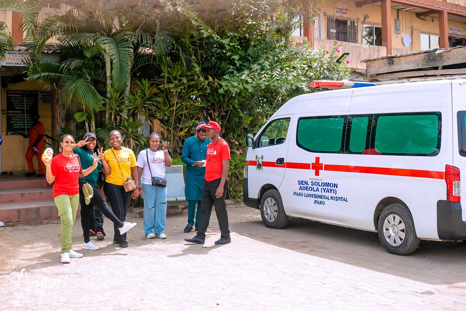 Volunteers beside an ambulance at a medical outreach